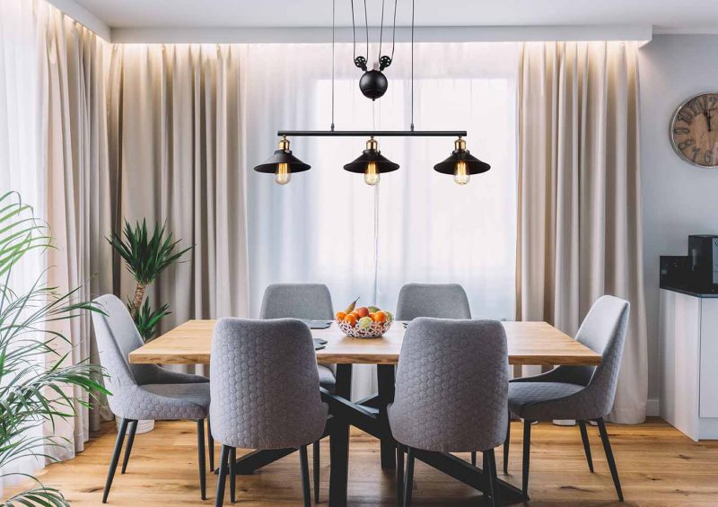 Dining,Room,With,Wooden,Table,And,Floor,In,Modern,Apartment.